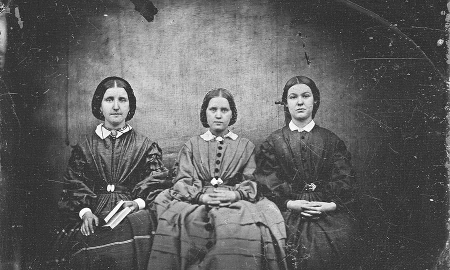 Three unidentified nineteenth-century women seated for the collodion positive whose reverse was read as Bells.